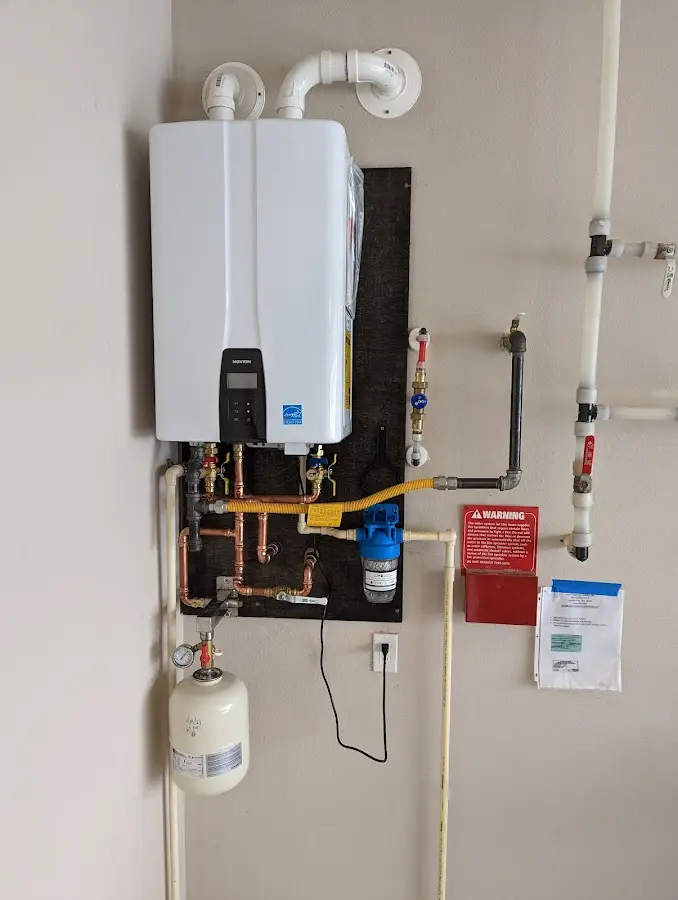 Professional plumber installing copper piping in a Wentzville home